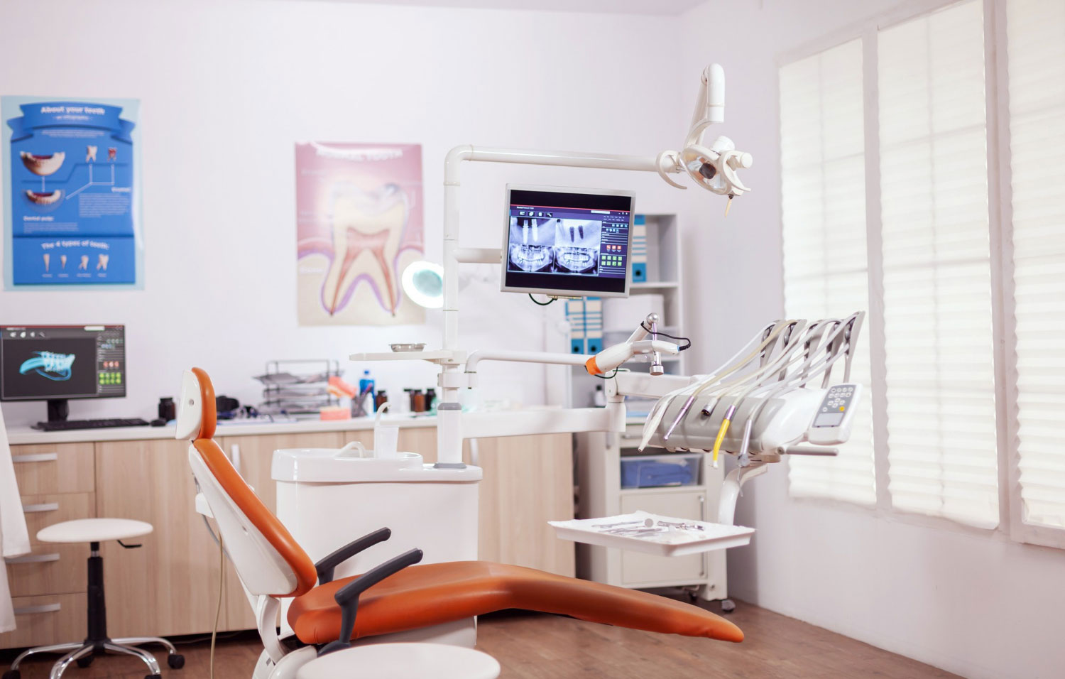 dental-chair-other-accesorries-used-by-dentist-empty-cabinet-stomatology-cabinet-with-nobody-it-orange-equipment-oral-treatment